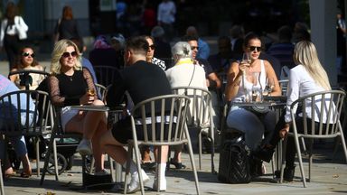People pictured sitting outside at a restaurant in Chelsea, London. File pic
